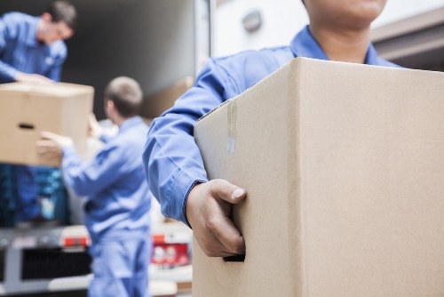 Experienced movers handling a flat removals job in Brompton