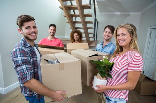 Moving boxes and furniture during a Brompton flat relocation