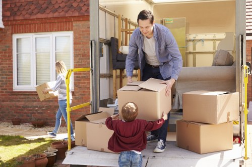 Packed boxes and luggage ready for student removals in Brompton