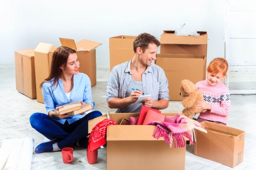 Professional house removalists in Brompton loading moving boxes into a truck