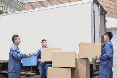 Sustainable moving van loaded with recyclable boxes in Brompton