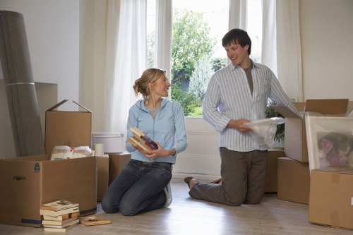 House removal team handling furniture in a Brompton property