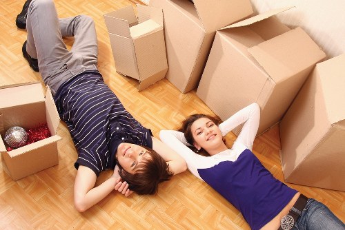 Professional movers handling office equipment during commercial moves in Brompton
